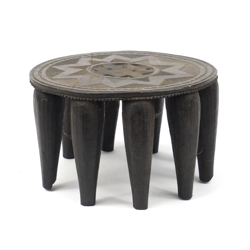 2111 - Tribal interest carved hardwood stool, 35.5cm in diameter