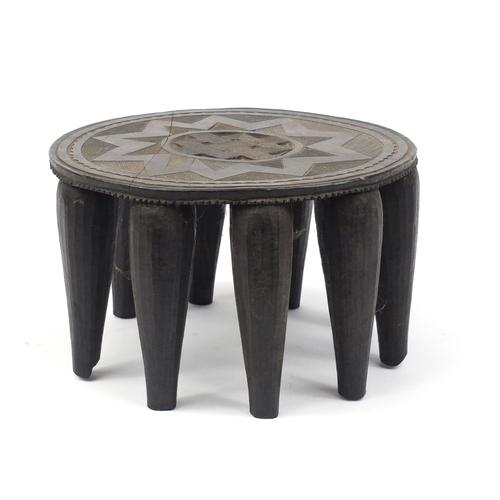 2111 - Tribal interest carved hardwood stool, 35.5cm in diameter