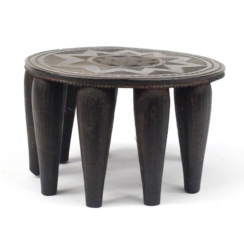 2111 - Tribal interest carved hardwood stool, 35.5cm in diameter