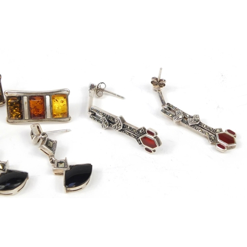 2770 - Three pairs of silver earrings including marcasite and amber examples