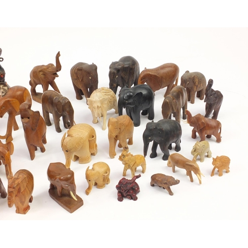 2468 - Large collection of mostly wooden elephants including some ebony, the largest 20cm high