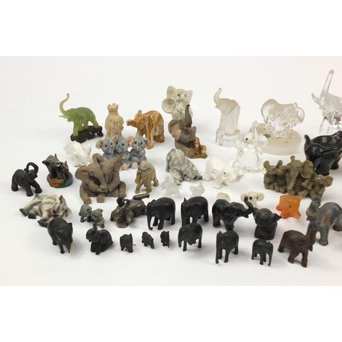 2457 - Large collection of model elephants including glass, ceramic, pottery and wooden examples, the large... 