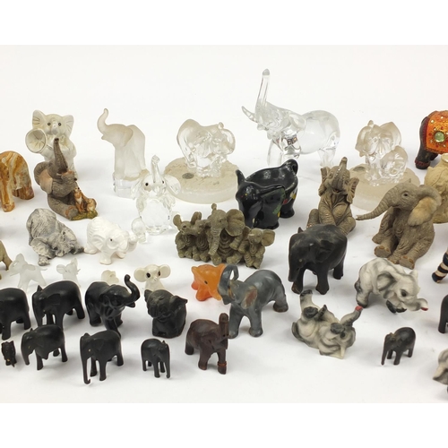 2457 - Large collection of model elephants including glass, ceramic, pottery and wooden examples, the large... 