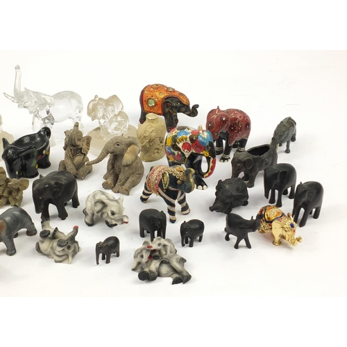 2457 - Large collection of model elephants including glass, ceramic, pottery and wooden examples, the large... 