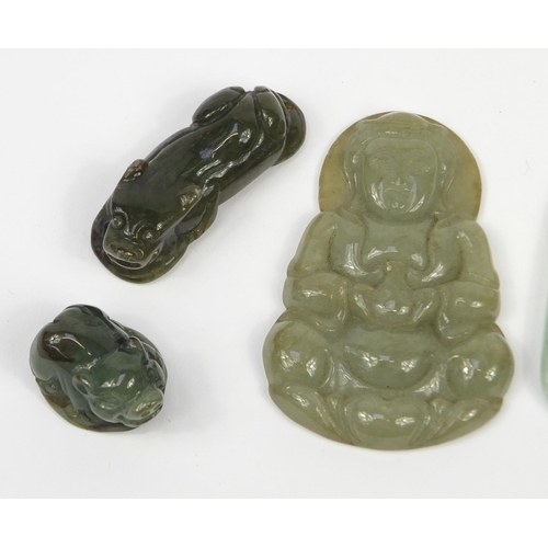 2754 - Five Chinese jade pendants, including one carved with a Buddha, the largest 5cm high