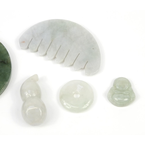 2777 - Five Chinese jade carvings including one of a double gourd vessel, the largest 5.5cm wide