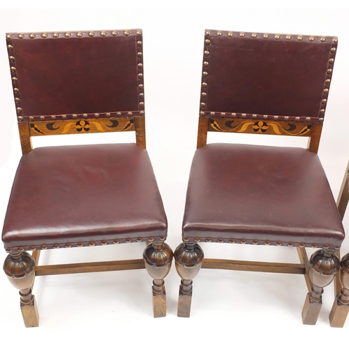 67 - Set of four Arts & Crafts inlaid oak dining chairs by James Shoolbred & Co, with carved cup and cove... 