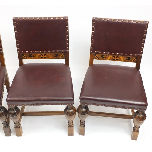 67 - Set of four Arts & Crafts inlaid oak dining chairs by James Shoolbred & Co, with carved cup and cove... 