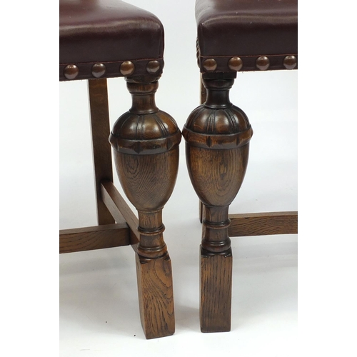 67 - Set of four Arts & Crafts inlaid oak dining chairs by James Shoolbred & Co, with carved cup and cove... 