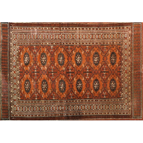 2023 - Afghan brown ground rug with all over geometric design, 190cm x 125cm