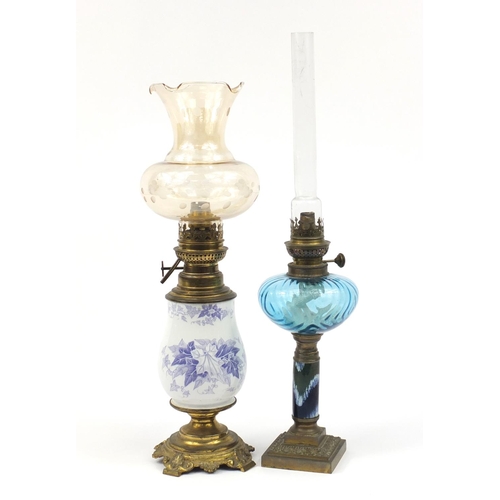 2190 - Two oil lamps with ornate metal mounts, one converted for electric use