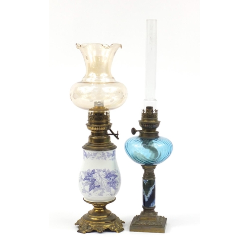 2190 - Two oil lamps with ornate metal mounts, one converted for electric use