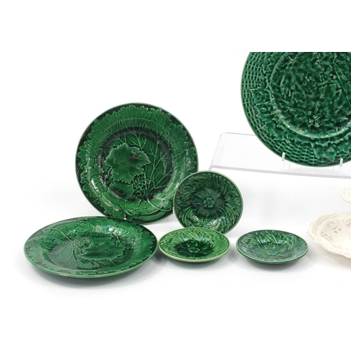 2565 - Four Majolica leaf plates and a Cream ware chamber stick, the largest 22.5cm in diameter