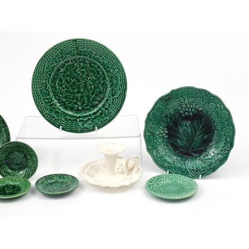 2565 - Four Majolica leaf plates and a Cream ware chamber stick, the largest 22.5cm in diameter