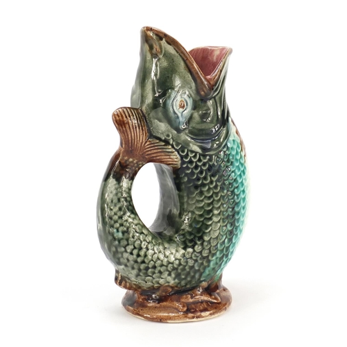 2180 - Majolica gurgle vase in the form of a dolphin, 24cm high