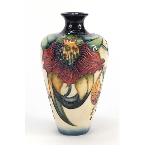 60 - Moorcroft pottery vase with box, hand painted with stylised flowers, 16cm high