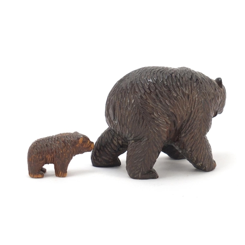 2814 - Two Black Forest carved wood bears, the largest 9.5cm in length