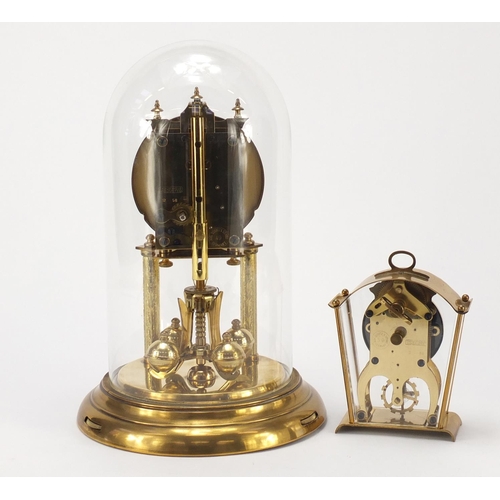 2616 - Two Schatz clocks including an anniversary example with glass dome, the largest 30cm high