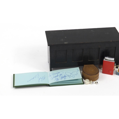 3023 - Objects including a vintage Lisistor radio lighter, hip flask and book of autographs and a miniature... 