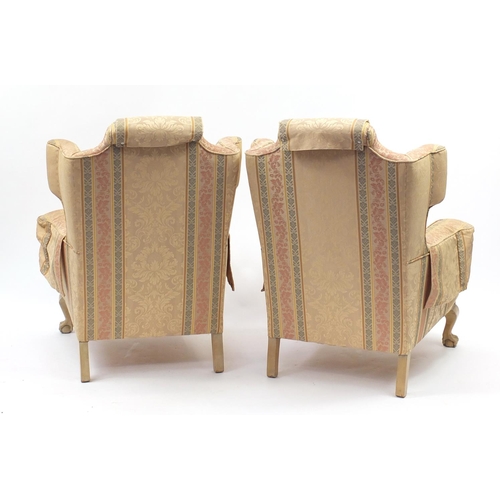 2013 - Pair of wingback armchairs with ball and claw feet and striped upholstery, 100cm high