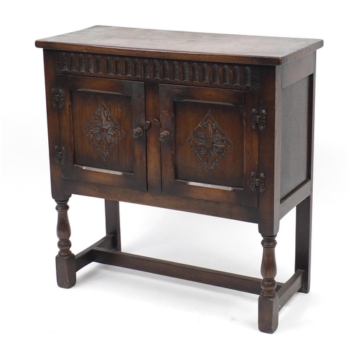 2109 - Carved oak side cabinet fitted with a pair of cupboard doors, 76cm H x 75cm W x 32cm D