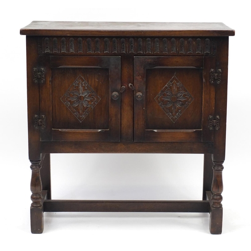 2109 - Carved oak side cabinet fitted with a pair of cupboard doors, 76cm H x 75cm W x 32cm D