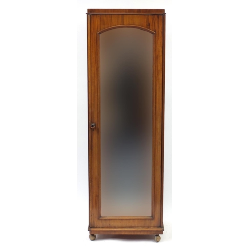 2118 - Walnut single wardrobe with mirrored door enclosing four pull out shelves above three drawers, 195cm... 