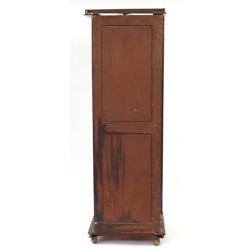 2118 - Walnut single wardrobe with mirrored door enclosing four pull out shelves above three drawers, 195cm... 