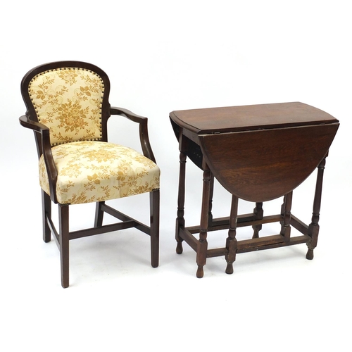 2061 - Oak drop-leaf table and open armchair with floral upholstery