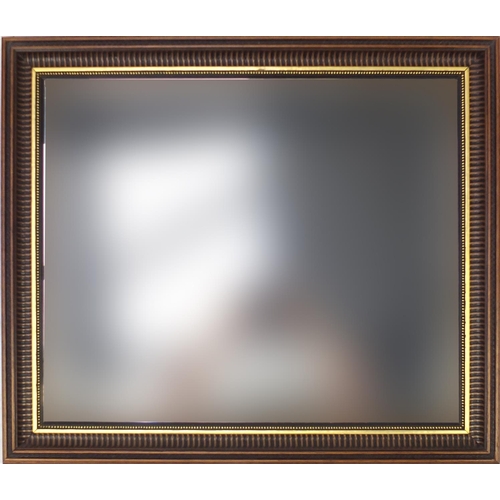 2135 - Mahogany and gilt framed wall mirror with bevelled glass, 73cm x 61cm