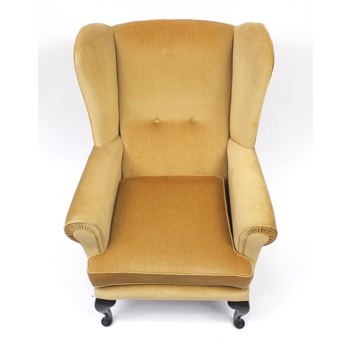 2048 - Sherwood mahogany framed wingback armchair with gold upholstery, 101cm high