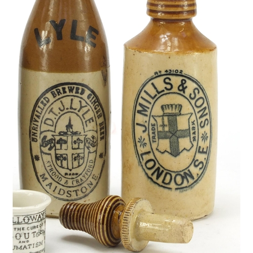 2246 - Three antique stoneware bottles and an ointment jar, the largest 22cm high