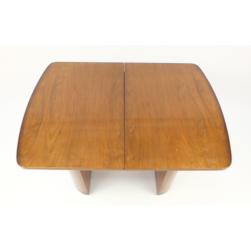 2005 - Art Deco walnut draw-leaf dining table and six chairs including two carvers with cream leather backs... 