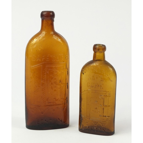 3017 - Two antique Warners safe cure glass bottles