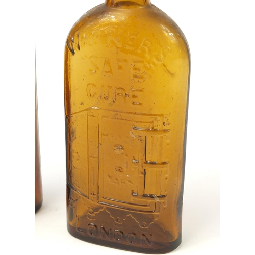 3017 - Two antique Warners safe cure glass bottles