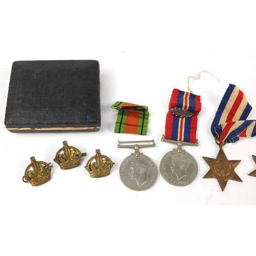 2919 - British military World War II militaria including medals and two oak leaves