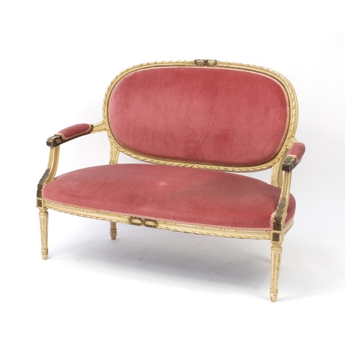 2050 - French style cream and gilt two-seater salon settee with pink upholstery, 120cm in length