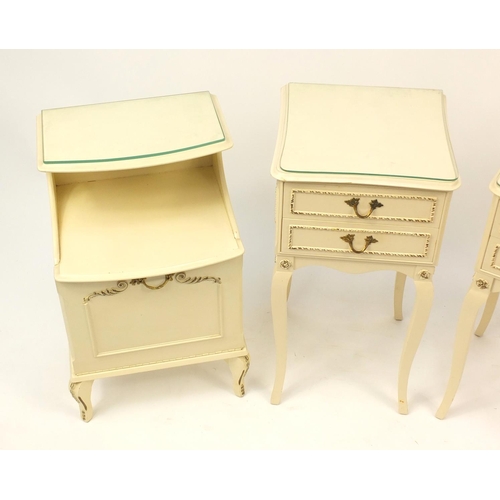 2055 - Pair of cream and gilt bedside tables and one other