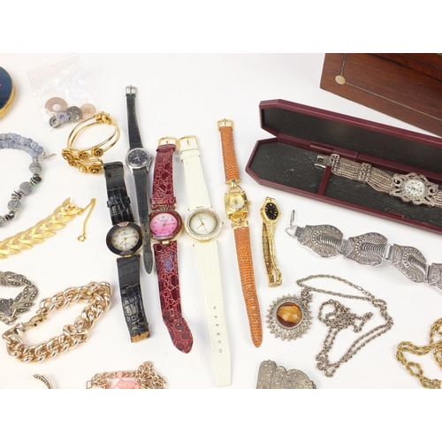 2950 - Costume jewellery including wristwatches, necklaces, bracelets and earrings housed in a rosewood box... 