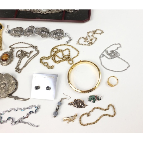 2950 - Costume jewellery including wristwatches, necklaces, bracelets and earrings housed in a rosewood box... 