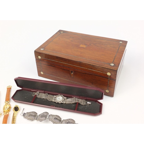 2950 - Costume jewellery including wristwatches, necklaces, bracelets and earrings housed in a rosewood box... 