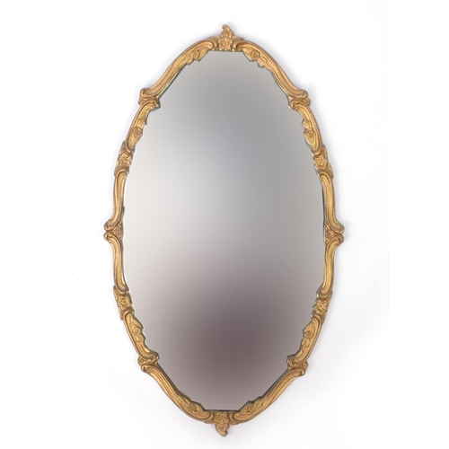 2036 - Ornate oval gilt framed mirror, 72cm x 42cm