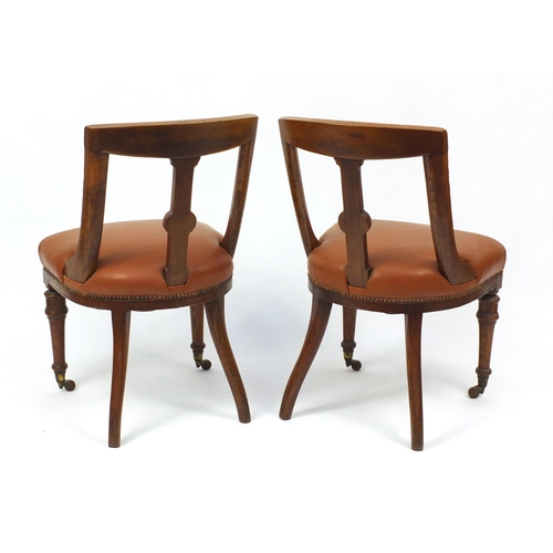 2017 - Pair of Victorian oak chairs with brown leather seats, 85cm high
