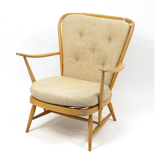 2053 - Ercol light elm Windsor stick back arm chair, 83cm high