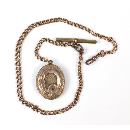 153 - Unmarked gold graduated chain (tests as 9ct gold) and a Victorian gold plated locket, the chain 18.0... 