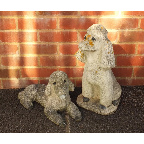 2144 - Two stoneware garden statues of dogs, the largest 48cm high