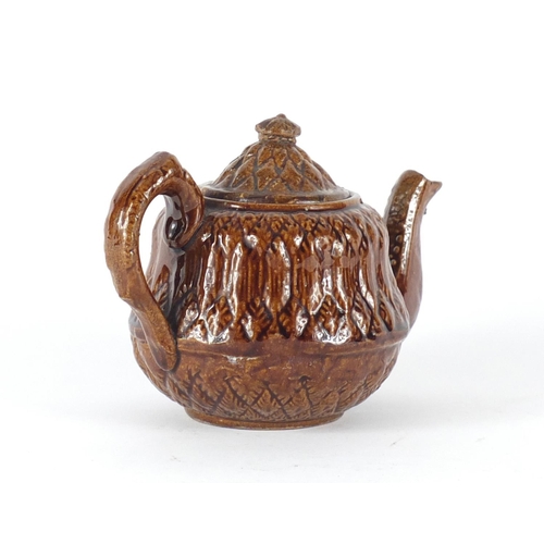 2286 - 19th century treacle glazed pottery teapot with corn design , 11cm high