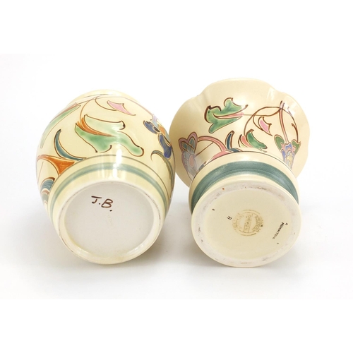 2646 - Two Honiton vases, both hand painted with stylised flowers, the largest 18cm high