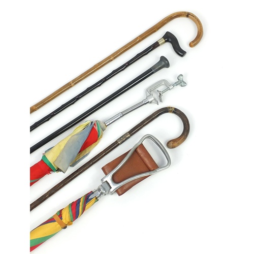 2325 - Walking sticks and shooting sticks including one with silver pommels and one with silver collar