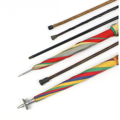 2325 - Walking sticks and shooting sticks including one with silver pommels and one with silver collar